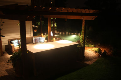 Image: Tier One Landscape pond, landscape, and outdoor room lighting.
