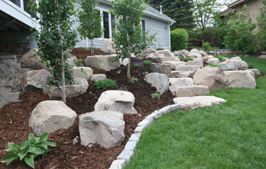 Image: Tier One Landscape boulder work.